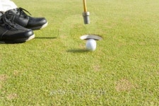 Man holding flag pole, golf ball rolling into hole, blurred motion, Saipan, USA  이미지 (80649246) - 게티이미지뱅크 Man... 