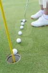 Close Up Image of Six Golf Balls Placed on Green, Woman Putting on Green 이미지 (80649315) - 게티이미지뱅크 Close Up Image... 