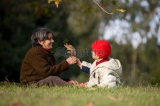 Grandmother and grandchild playing on meadows 이미지 (89353656) - 게티이미지뱅크 Grandmother and grandchild playing on meadows