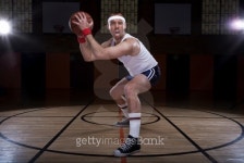 Old school aggressive basketball player in a dark gym 이미지 (147245670) - 게티이미지뱅크 Old school aggressive basketball... 