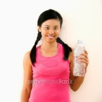 Young woman in fitness outfit holding bottled water and smiling. 이미지 (126439446) - 게티이미지뱅크 Young woman in fitness... 