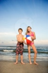 Caucasian pre-teen boy and girl holding beachball on beach. 이미지 (126416309) - 게티이미지뱅크 Caucasian pre-teen boy and... 