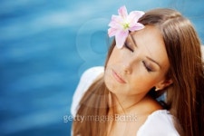 Beautiful face of woman with lily in her hair 이미지 (101133820) - 게티이미지뱅크 Beautiful face of woman with lily in her hair