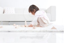 Baby girl playing with wooden building blocks 이미지 (102755698) - 게티이미지뱅크 Baby girl playing with wooden building blocks