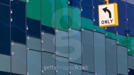 Road Sign Pointing to Abstract Glass Wall 이미지 (119183874) - 게티이미지뱅크 Road Sign Pointing to Abstract Glass Wall