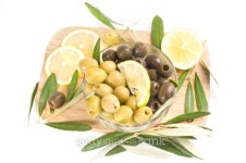 green and black olives with lemon on a wooden board 이미지 (146967310) - 게티이미지뱅크 green and black olives with lemon on... 