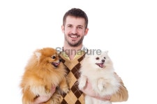 Attractive Young Man Holding 2 Pomeranian Dogs 이미지 (182489815) - 게티이미지뱅크 Attractive Young Man Holding 2 Pomeranian Dogs