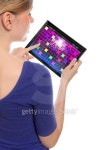 woman holding a touchpad pc, playing retro arcade game 이미지 (119798134) - 게티이미지뱅크 woman holding a touchpad pc... 