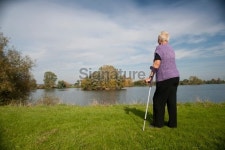 Woman with crutches in autumn landscape 이미지 (183216078) - 게티이미지뱅크 Woman with crutches in autumn landscape