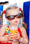 Child in glasses and red bikini drink juice. 이미지 (121106742) - 게티이미지뱅크 Child in glasses and red bikini drink juice.