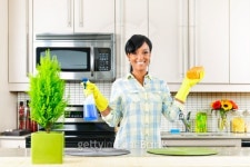 Young woman cleaning kitchen 이미지 (114327047) - 게티이미지뱅크 Young woman cleaning kitchen
