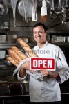Professional chef holding loaves of freshly baked bread 이미지... Professional chef holding loaves of freshly baked bread