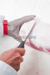 Professional meat cutter with protective glove 이미지 (183761725) - 게티이미지뱅크 Professional meat cutter with protective glove