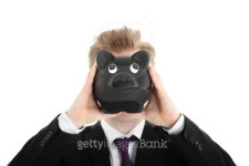 Businessman holding a piggybank in front of face 이미지 (147456284) - 게티이미지뱅크 Businessman holding a piggybank in front... 