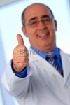 Thumbs up with out of focus male in background 이미지 (184962771) - 게티이미지뱅크 Thumbs up with out of focus male in background