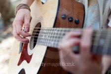 Closeup of acoustic guitar playing outdoors 이미지 (177032735) - 게티이미지뱅크 Closeup of acoustic guitar playing outdoors