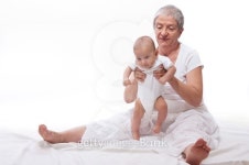 Grandmother playing with a baby 이미지 (177539453) - 게티이미지뱅크 Grandmother playing with a baby