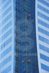 Workers suspended high up on a blue glass 이미지 (178402045) - 게티이미지뱅크 Workers suspended high up on a blue glass