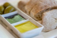 Bread, olive oil, vinegar and olives on a plate 이미지 (185827188) - 게티이미지뱅크 Bread, olive oil, vinegar and olives on a... 