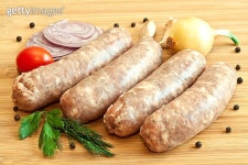 Uncooked sausages with vegetables on the chopping board 이미지 (176195710) - 게티이미지뱅크 Uncooked sausages with vegetables... 