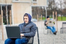 Boy with PC on the bench 이미지 (459163847) - 게티이미지뱅크 Boy with PC on the bench