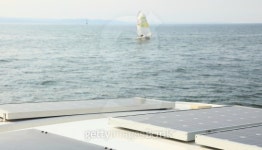 Solar Panels charging batteries aboard sail boat 이미지 (185887259) - 게티이미지뱅크 Solar Panels charging batteries aboard... 