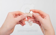 Changing a hearing aid battery 이미지 (178079721) - 게티이미지뱅크 Changing a hearing aid battery