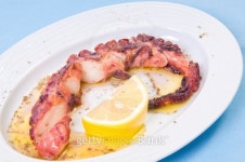 Grilled octopus with lemon sauce. 이미지 (166442925) - 게티이미지뱅크 Grilled octopus with lemon sauce.
