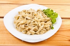Tagliatelle pasta with pesto on white plate 이미지 (516484649) - 게티이미지뱅크 Tagliatelle pasta with pesto on white plate