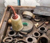 oil bottle on dirty steel part in garage 이미지 (489907769) - 게티이미지뱅크 oil bottle on dirty steel part in garage