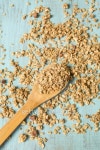 Almond Breakfast Cereal Granola On Wood Spoon And Spilled... Almond Breakfast Cereal Granola On Wood Spoon And Spilled