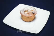 Muffin with raisins on white plate 이미지 (479070057) - 게티이미지뱅크 Muffin with raisins on white plate