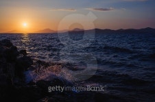sunset over the sea on a background of mountains 이미지 (515923851) - 게티이미지뱅크 sunset over the sea on a background of... 