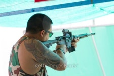 Target practicing with gun In the shooting range 이미지 (487747041) - 게티이미지뱅크 Target practicing with gun In the... 