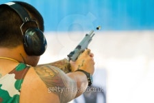 Target practicing with gun In the shooting range 이미지 (487747061) - 게티이미지뱅크 Target practicing with gun In the... 
