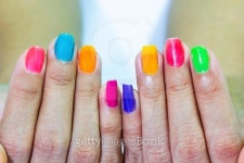 Multi-colored the hands with a bright nail polish 이미지 (518403091) - 게티이미지뱅크 Multi-colored the hands with a bright... 