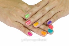 Multi-colored the hands with a bright nail polish 이미지 (518403115) - 게티이미지뱅크 Multi-colored the hands with a bright... 