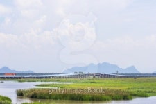 Concrete road across the lake called Ekachai Road 이미지 (513101517) - 게티이미지뱅크 Concrete road across the lake called... 