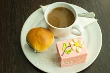 Hot coffee in white cup with sandwich ham&cheese and sweetmeat... Hot coffee in white cup with sandwich ham&cheese and sweetmeat