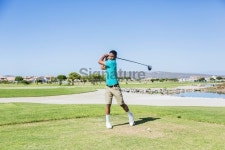 African golfer driving the golf ball from the pin 이미지 (491069097) - 게티이미지뱅크 African golfer driving the golf ball... 