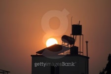 Sunset behind Solar water heater 이미지 (475139355) - 게티이미지뱅크 Sunset behind Solar water heater