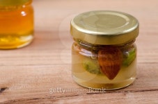 Honey with dried fruit and nut. 이미지 (477595874) - 게티이미지뱅크 Honey with dried fruit and nut.