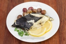 fish with olives and lemon on white plate 이미지 (466346696) - 게티이미지뱅크 fish with olives and lemon on white plate