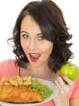 Woman Deciding Which is Best Fish and Chip or Apple 이미지 (478317458) - 게티이미지뱅크 Woman Deciding Which is Best Fish and... 