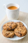Chocolate chip cookies and a cup of milk tea 이미지 (485559048) - 게티이미지뱅크 Chocolate chip cookies and a cup of milk tea