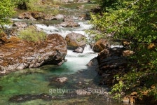 water flowing around a boulder 이미지 (477956896) - 게티이미지뱅크 water flowing around a boulder