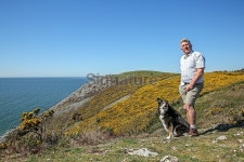 Mature man and his dog hiking in Wales 이미지 (471052796) - 게티이미지뱅크 Mature man and his dog hiking in Wales