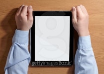 Boy holding a PC sitting at the table. Top view. 이미지 (473919376) - 게티이미지뱅크 Boy holding a PC sitting at the table.... 