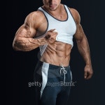 Handsome bodybuilder with with great physique shows his six pack 이미지 (485227560) - 게티이미지뱅크 Handsome bodybuilder... 