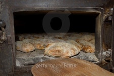 Taking the bread from the oven 이미지 (487060098) - 게티이미지뱅크 Taking the bread from the oven
